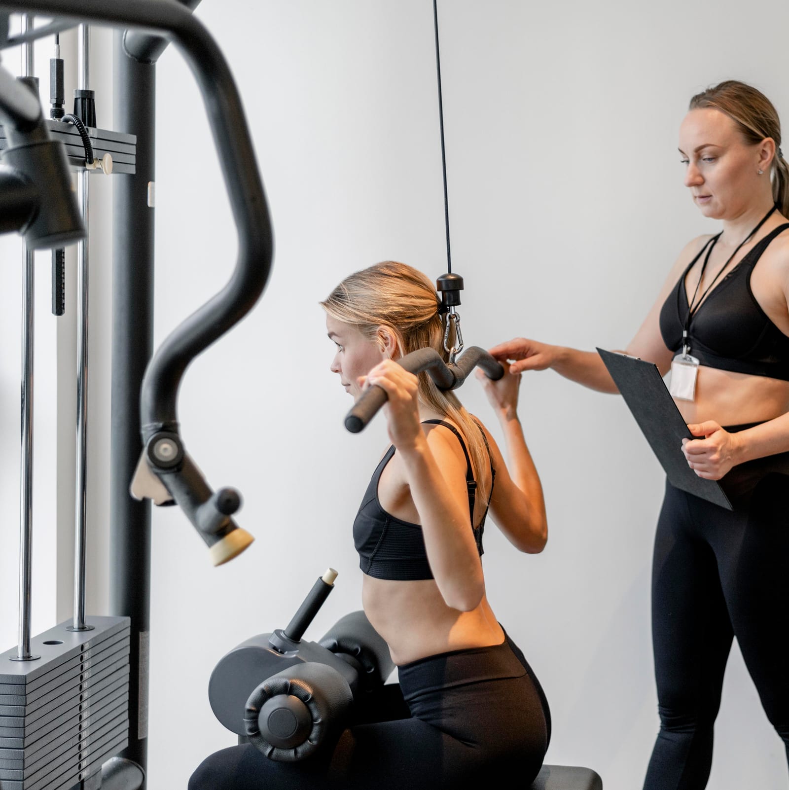 Breakthrough Fitness trainer coaching a client in the gym